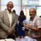 Evencio Ferrero e membros da corporación municipal recibiron ao alcalde de Xenebra, o cormelán Alfonso Gómez Cruz